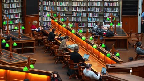 General-publics-studying-and-learning-within-the-majestic-La-Trobe-Reading-Room-at-the-State-Library-Victoria,-Melbourne-city