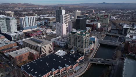 Downtown-Reno-Nevada-USA-Buildings,-Street-and-Bridge-Traffic,-Drone-Aerial-View