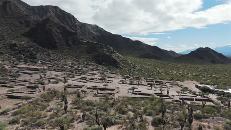 Scenic-aerial-above-the-Quilmes-Ruins-in-desert-landscape,-Argentina