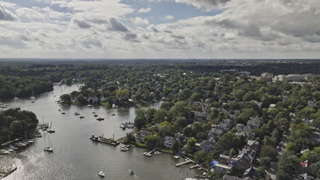 Annapolis-Maryland-Aerial-v16-flyover-Spa-Creek-capturing-leafy-residential-neighborhood,-boats-on-the-water-inlet-and-Admiral-Heights-views-in-distance---Shot-with-Mavic-3-Pro-Cine---September-2023