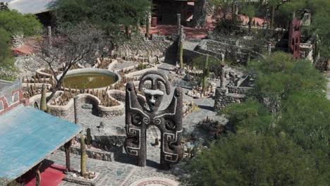 Aerial-view-of-Museo-Pachamama-with-intricate-stone-architecture-and-sculptures,-Amaicha-del-Valle