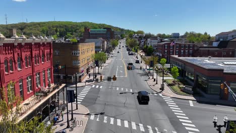 Aerial-view-of-Ephrata,-PA,-showcasing-its-charming-downtown-area-with-historic-buildings,-a-mix-of-modern-and-traditional-architecture,-and-bustling-streets