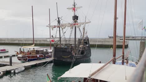 Historic-Santa-Maria-de-Colombo-ship-docked-in-Funchal-harbor-on-a-cloudy-day