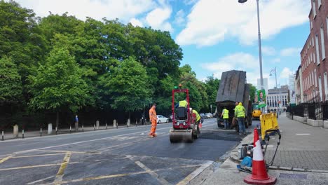 A-static-shot-of-a-tarmac-squad-repaing-road-surfaces-around-St-Stephens's-Geen-Dublin-Ireland