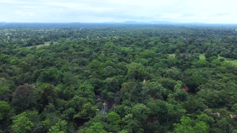 Panoramic-aerial-view-showcasing-the-fabulous-ruins-of-Beang-Maelae-Temple,-hidden-deep-within-the-jungle