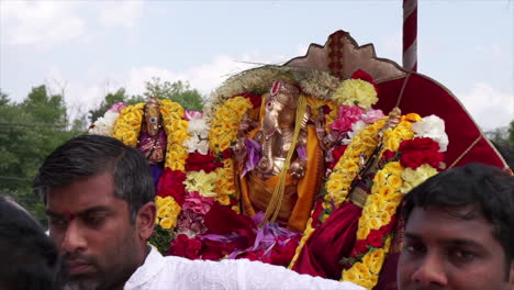 A-mudra-of-the-Hindu-deity,-Ganesh-is-carried-by-celebrants-at-Ganesh-Festival