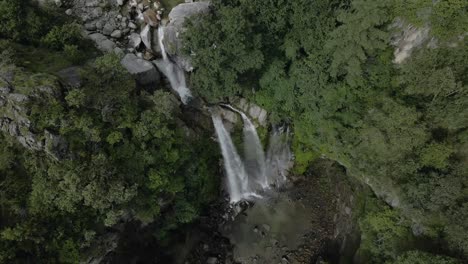 aerial-view-of-waterfall-middle-of-forest-in-Kulekhani,-Nepal