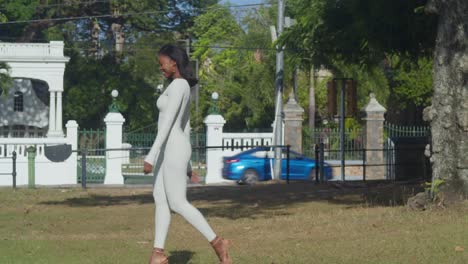 The-Caribbean-city-with-its-castles-provides-a-backdrop-for-a-young-girl-in-a-white-bodysuit