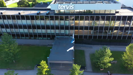 Aerial-approaching-shot-of-Tervis-Medical-Spa-Hotel-with-waving-flags-of-Estonia