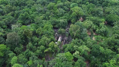 The-ruins-of-Beang-Maelae-Temple-viewed-from-above-by-a-drone,-situated-in-the-heart-of-the-dense-jungle