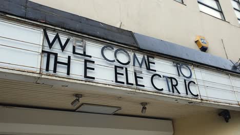 Close-up-of-vintage-retro-neon-welcome-sign-for-The-Electric-cinema-in-city-centre-of-Birmingham,-England-UK