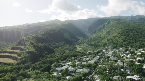 Aerial-shot-of-Grand-Bassin-with-Saint-denis-city-in-foreground-in-Reunion-Island,-France-on-a-sunny-day