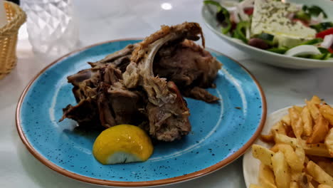 Restaurant-Style-Roasted-Meat-with-French-Fries-and-a-Fresh-Vegetable-Salad---Close-Up