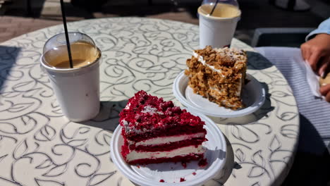 Pastries-and-coffee-are-served-on-a-patio-table,-ready-to-enjoy