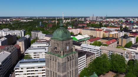 Aerial-pullback-past-stone-cathedral-church-in-middle-of-downtown-Helsinki-Finland