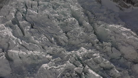 Drone-captures-ice-fall-and-mountains-at-Khumbu-Glacier,-Everest-Base-Camp,-Nepal