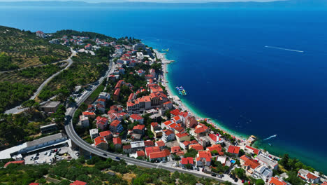 Aerial-overview-of-the-Podgora-town,-summer-day-in-Makarska-riviera,-Croatia