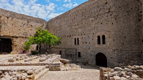 Zoom-in-shot-of-Medieval-Chlemoutsi-castle-in-Kastro-village,-Peloponnese,-Kyllini-Andravida,-Greece-on-a-sunny-day