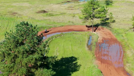 Aerial-view-of-amateur-racers-practicing-motocross-on-competition-track-in-countryside