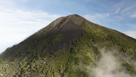 Cloud-shadow-covers-barren-basalt-soil-slope-on-lush-forest-growing-from-rich-volcanic-soil-in-Guatemala