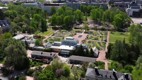 Aerial-dolly-of-garden-square-with-official-building-in-Helsinki-Finland-on-summer-day