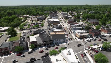 Brighton,-Michigan-downtown-with-traffic-and-drone-video-moving-right-to-left