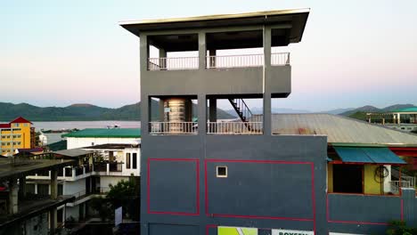 Drone-Ascend-Above-Neighborhood-With-Coron-Harbor-Coming-Into-View