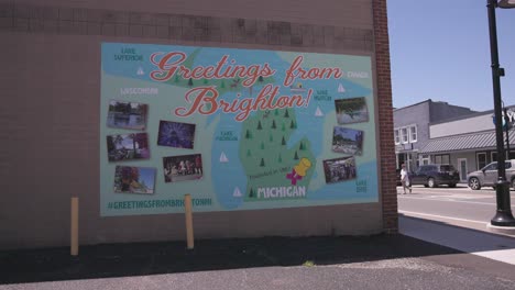 Greetings-from-Brighton,-Michigan-mural-with-video-panning-right-to-left