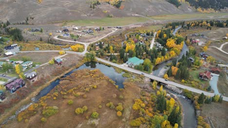 Countryside-of-Colorado-USA-in-Autumn-Season,-Aerial-View-of-Road-and-Buildings-in-Small-Community