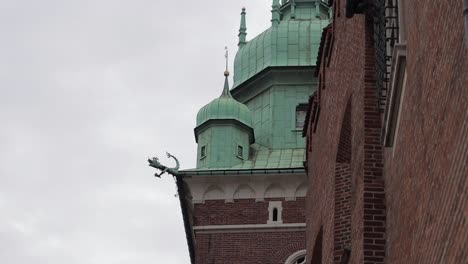 The-green-colored-domed-tower-of-Wawel-Royal-Castle,-a-historic-castle-in-Krakow,-Poland,-which-was-the-seat-of-Polish-kings-and-is-an-important-national-monument