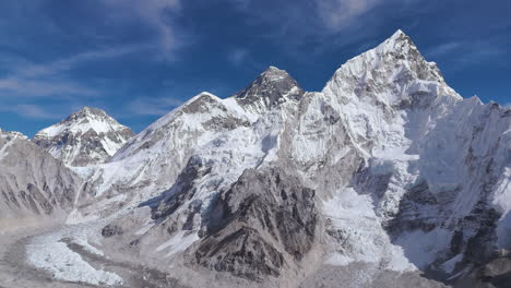 Drone-captures-Everest-Base-Camp-on-a-clear,-sunny-day-in-Nepal,-highlighting-the-melting-Khumbu-Glacier