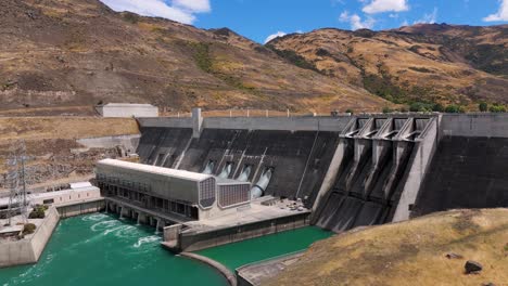 Aerial-the-Clyde-Dam,-New-Zealand's-second-largest-hydroelectric-dam,-situated-on-the-Clutha-River