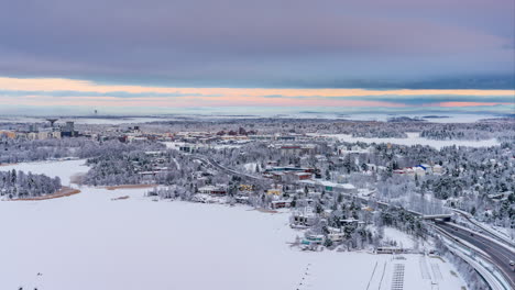 Timelapse-of-a-dark-winter-evening-above-the-snowy-Kulosaari-island-in-Helsinki