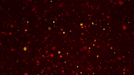 Sparkling-gold-molecule-move-in-a-red-water-background,-slow-motion