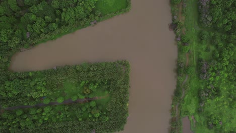 Top-down-aerial-view-of-a-water-channel-irrigation-system-in-Hanoi,-Vietnam,-illustrating-the-concept-of-efficient-water-management-and-sustainable-agriculture