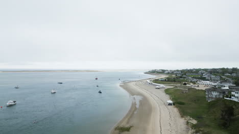 Boats-Off-Sandy-Shore-On-The-Atlantic-Ocean-In-Chatham,-Cape-Cod,-Massachusetts