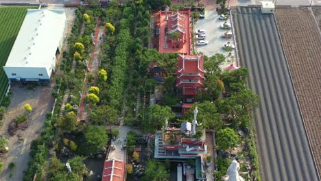 Aerial-birds-eye-view-flyover-Chifa-Matsu-Temple-amidst-agricultural-fields,-a-sacred-site-dedicated-to-goddess-of-sea,-showcasing-a-blend-of-cultural-heritage-and-rural-landscape,-Yunlin,-Taiwan