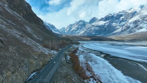 Drone-capturing-highways-leading-Skardu-mountains-on-a-winter-morning