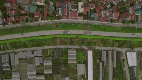 Top-down-view-of-houses-in-Hanoi,-Vietnam,-showcasing-unique-urban-planning-and-harmonious-coexistence-with-nature