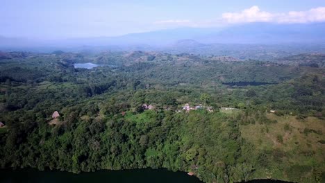 Aerial-View-Of-Luxury-Hotel-With-Thatched-Roof-Lodges-Near-Fort-Portal-In-Western-Uganda,-Africa