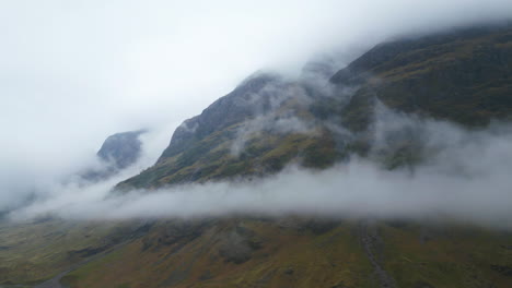 Dramatic-Aerial-Pullback-of-Scottish-Highlands-and-Clouds-Rolling-Down-from-the-Mountain