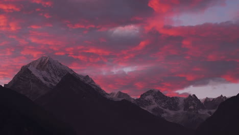 Drone-captures-majestic-sunset-over-mountains-seen-from-Namche-Bazaar-on-Everest-Base-Camp-trek,-Nepal