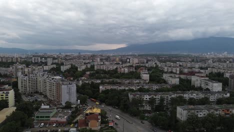 Elevator-shot-of-a-city-full-of-old-communist-era-apartment-buildings-with-a-lot-of-green-trees-in-between