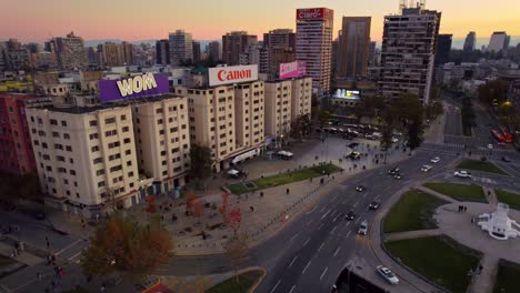 Aerial-Drone-Fly-Iconic-Buildings-in-Baquedano-Santiago-de-Chile-City-at-Sunset