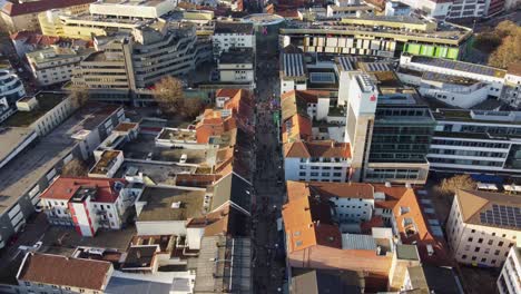 Busy-Marketplace-Street-and-Shopping-Mall-of-Kaiserslautern-at-Christmas,-Drone-View