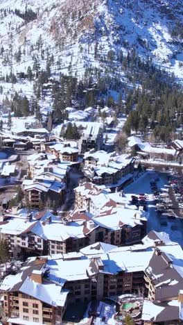 Vertical-Drone-Shot-of-Lake-Tahoe-Ski-Resort,-Olympic-Valley,-Aerial-Tram-and-High-Camp,-California-USA