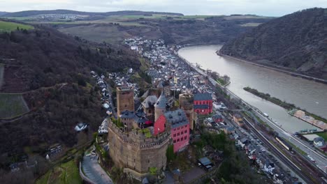 Drone-Flying-Over-Schoenburg-Castle-Hotel-Above-Oberwesel-Town,-Germany