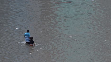 Record-breaking-rains-on-April-19,-2024,-leave-residents-to-navigate-a-flooded-road-in-the-northern-Emirates-of-the-UAE