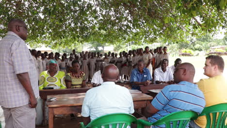 Line-of-students-standing-in-school-meeting-in-Kampala-city,-Uganda