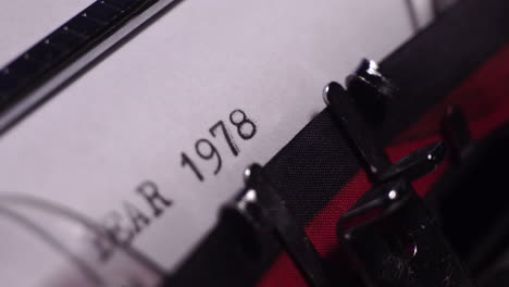 Year-1978,-Typing-in-Vintage-Typewriter-on-Blank-White-Paper,-Close-Up